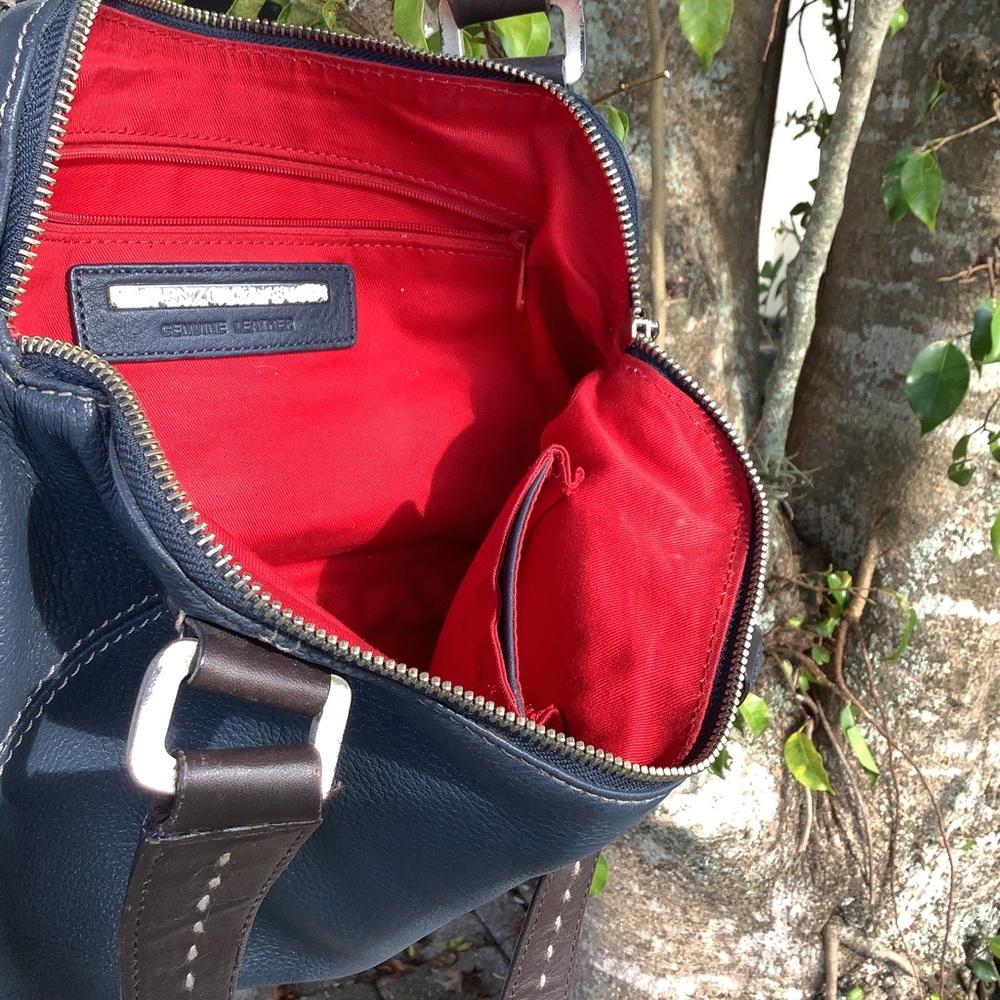Blue bag with brown stitched handles